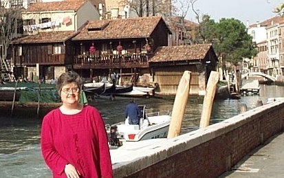 Photo of Margreta in front of the gondola workshop area