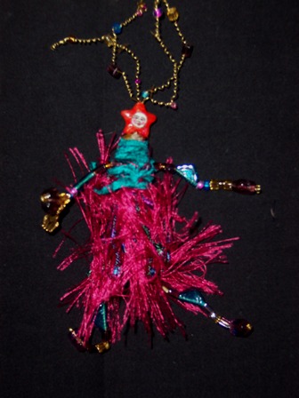 Isis wearable art brooch in hot fushia and teal and turquiso and purple. As the goddess, of course she'd wear bright colors.